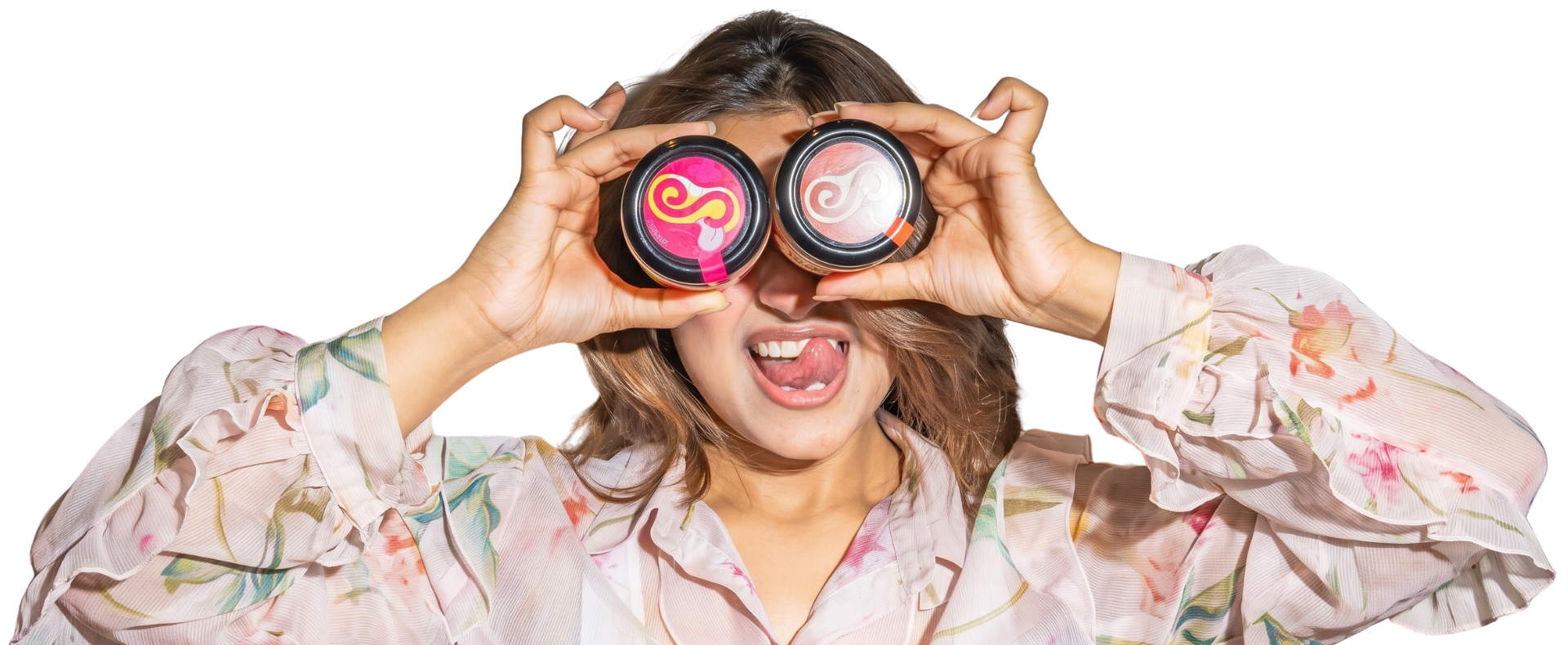 A woman holding two Nuteshwar jars over her eyes.