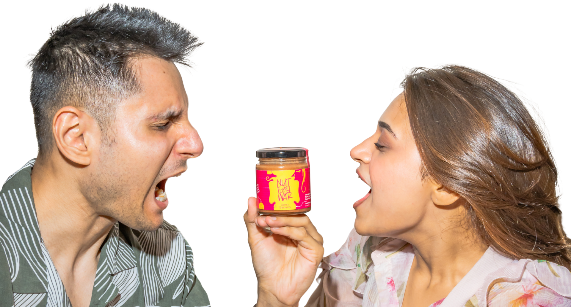 Two people reaching for a Nuteshwar Berry Banana nut butter jar