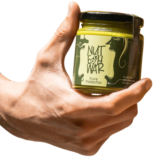 Hands holding a Pure Pistachio jar
